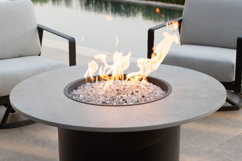 Nova fire pit is aluminum with a Dekton Top